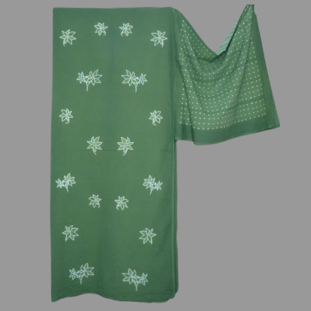 Sparkling shibori star flowers cambric fabric in a cool green summer colour.
