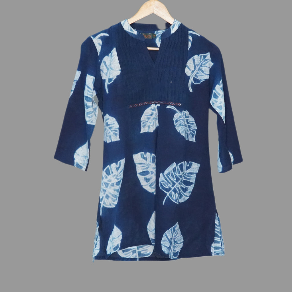 This casual indigo shibori top with vivid Monstera leaf design allover has a definite holiday vibe. The hand stitched detail on the yoke trim add a highlight to this charming top - 1
